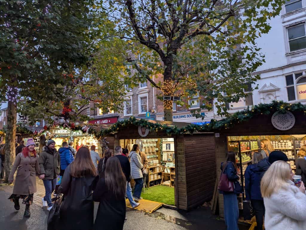 Christmas market in York - square with people and stalls.