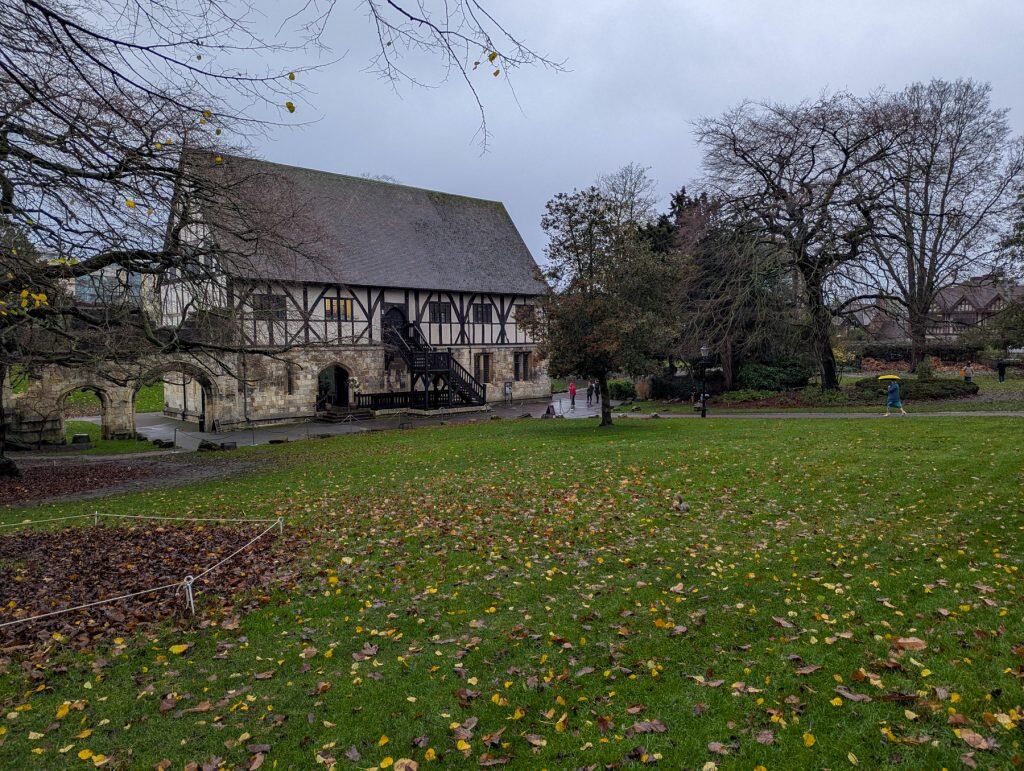 Museum Gardens in York with colourful trees and medieval buildings in autumn.