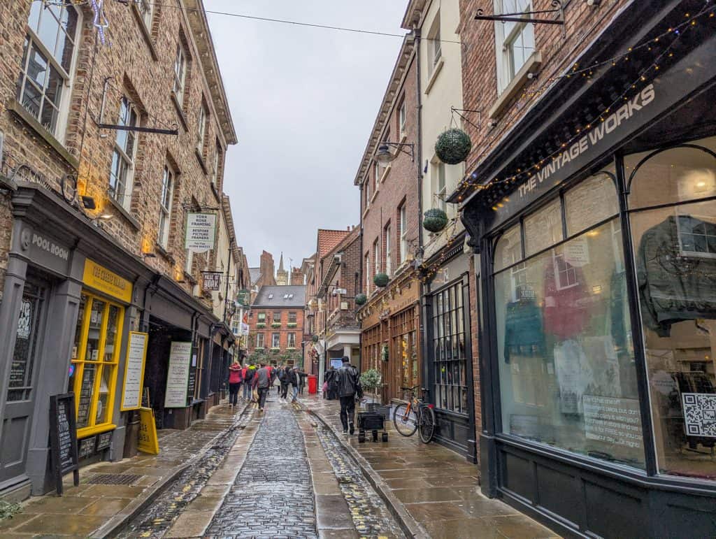 A street with historical buildings in York on a rainy day.
