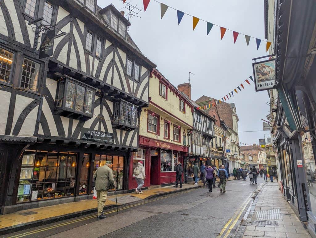 A street with historical buildings in York on a rainy day.