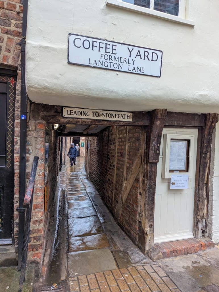 Entrance to one of York's Snickelways - a tiny medieval passage/street in the city centre; one of the best free things to do in York.