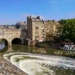 View at the river Avon with the Pulteney bridge and a boat.